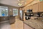 Open kitchen floor plan allows the cook to socialize too